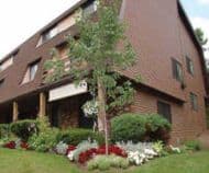 Multi-family property with maintained landscaping and flower beds