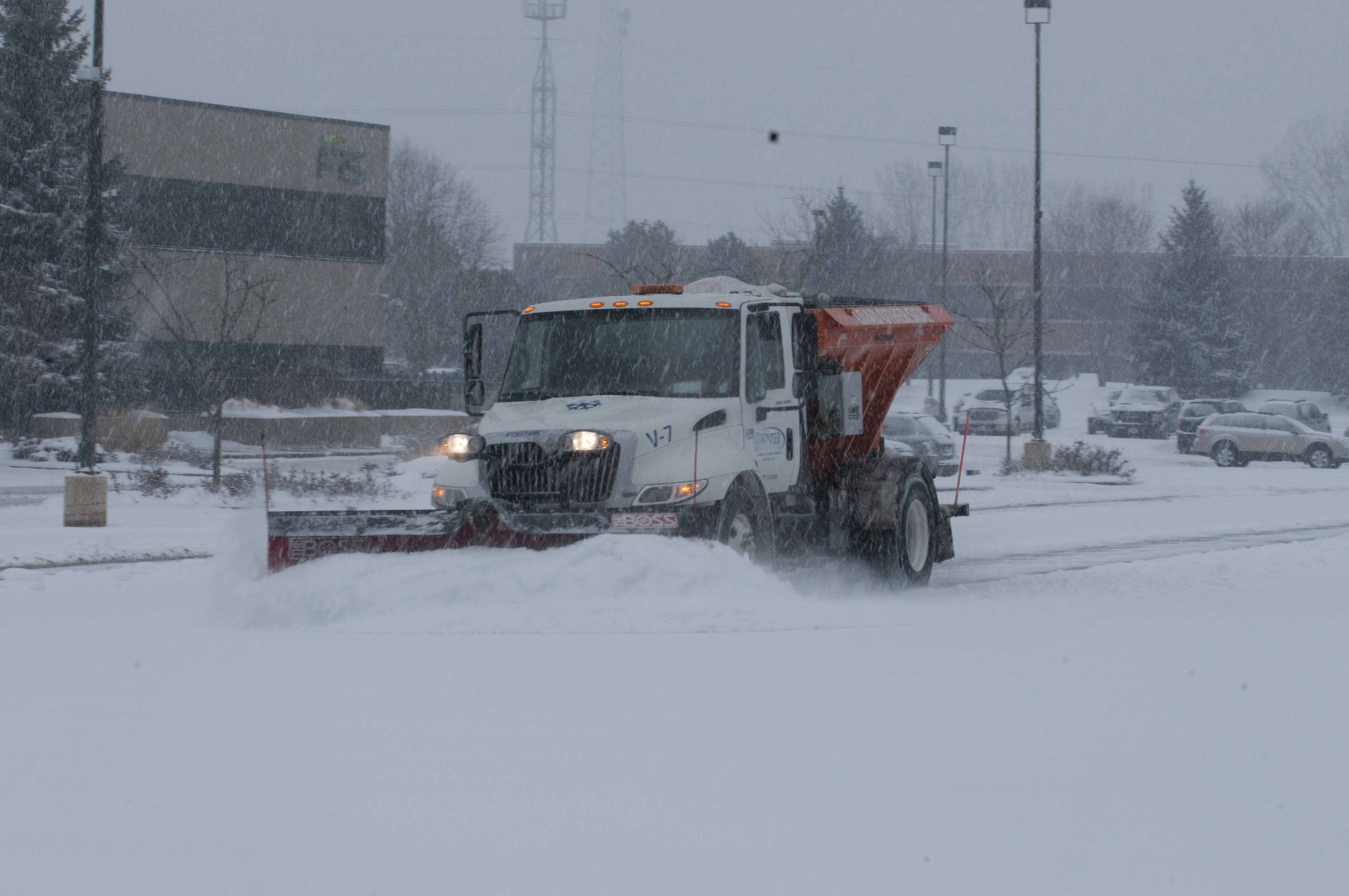 Snowplow Clearing Snow During Snowstorm